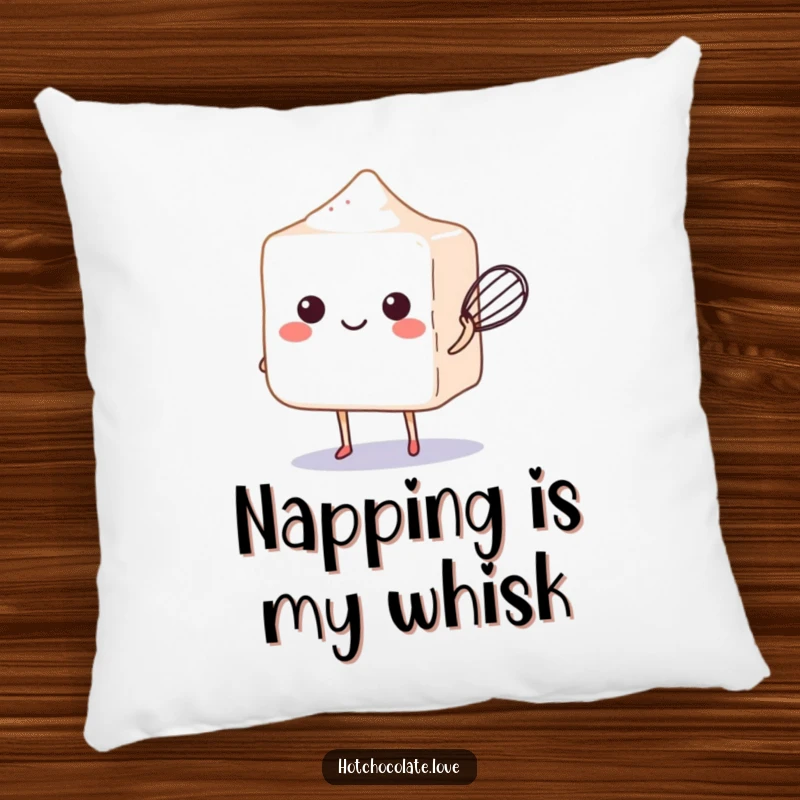 Funny sugar cube balancing a tiny whisk, presented on a soft and cozy decorative pillow.