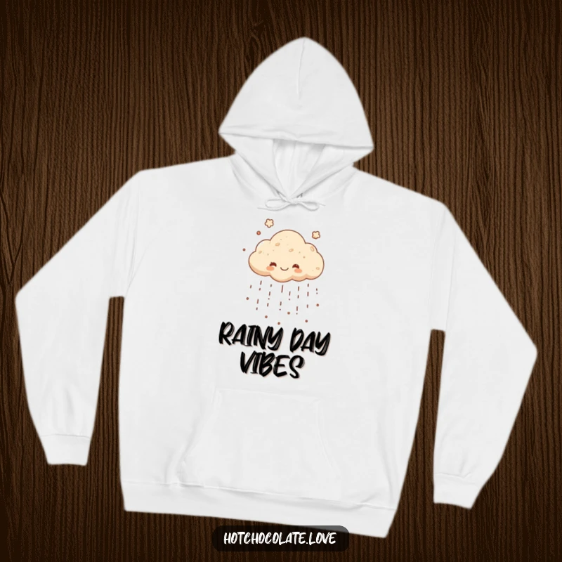Funny hoodie featuring a cheerful cocoa powder cloud raining down deliciousness, offering warm, humorous, and chocolate-themed comfort.