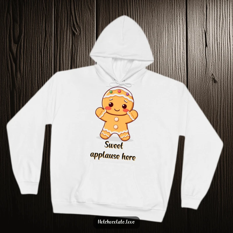 Funny hoodie featuring a delightful gingerbread cookie with its frosted hands clapping in celebration.