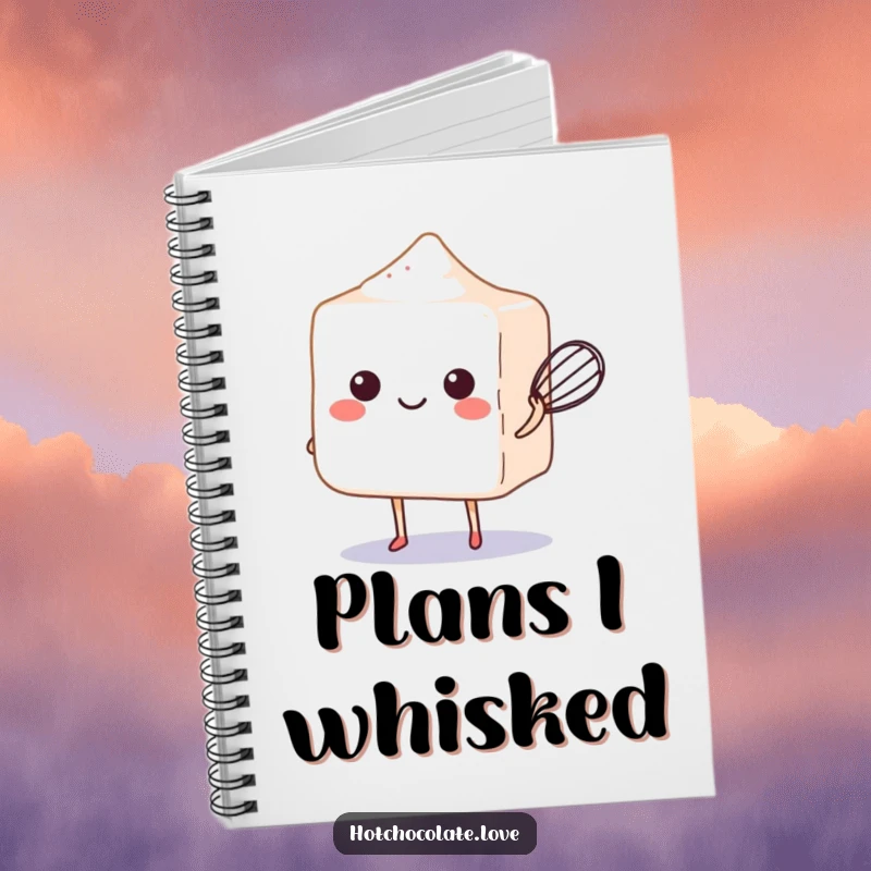 Funny sugar cube balancing a whisk on a notebook cover, inspiring baking and humorous notes.