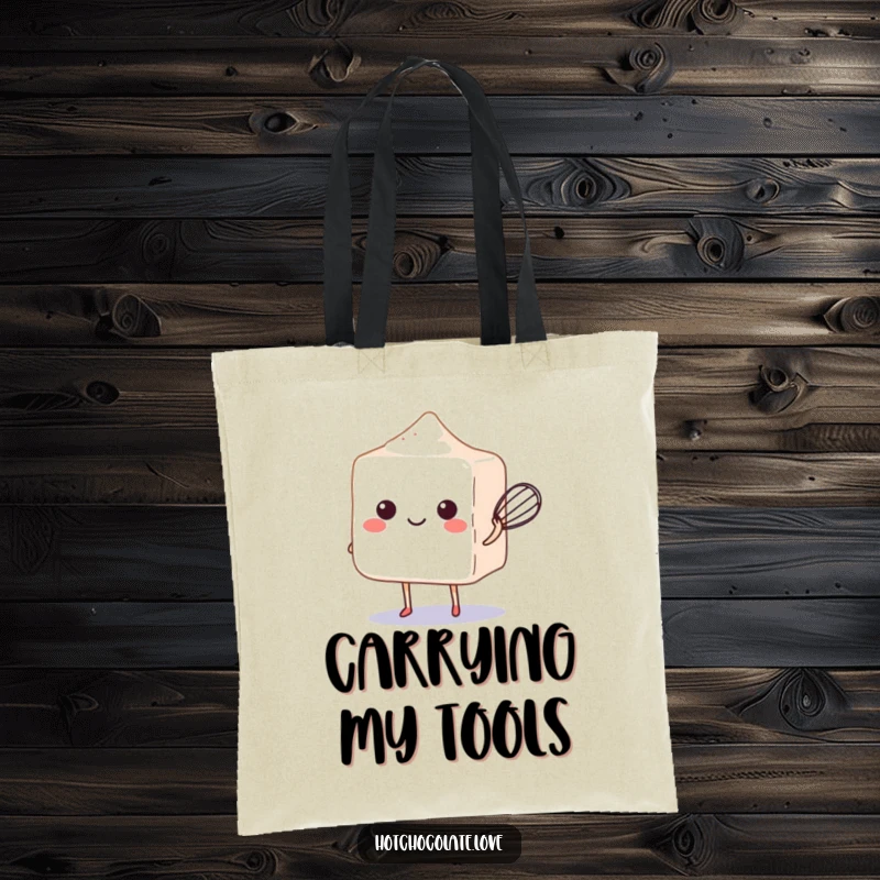 Funny sugar cube balancing a tiny whisk on a stylish and practical tote bag.